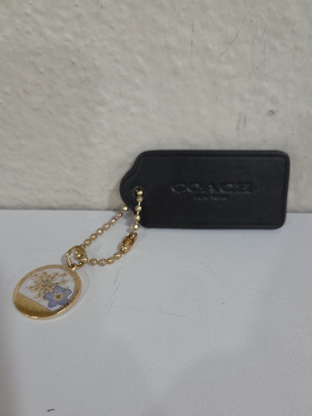 Coach Black Hang Tag With Dried Flower Charm